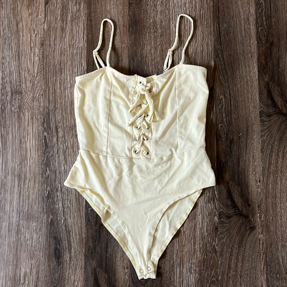 Forever 21 Pale Yellow Bodysuit Lace Up Front Sleeveless